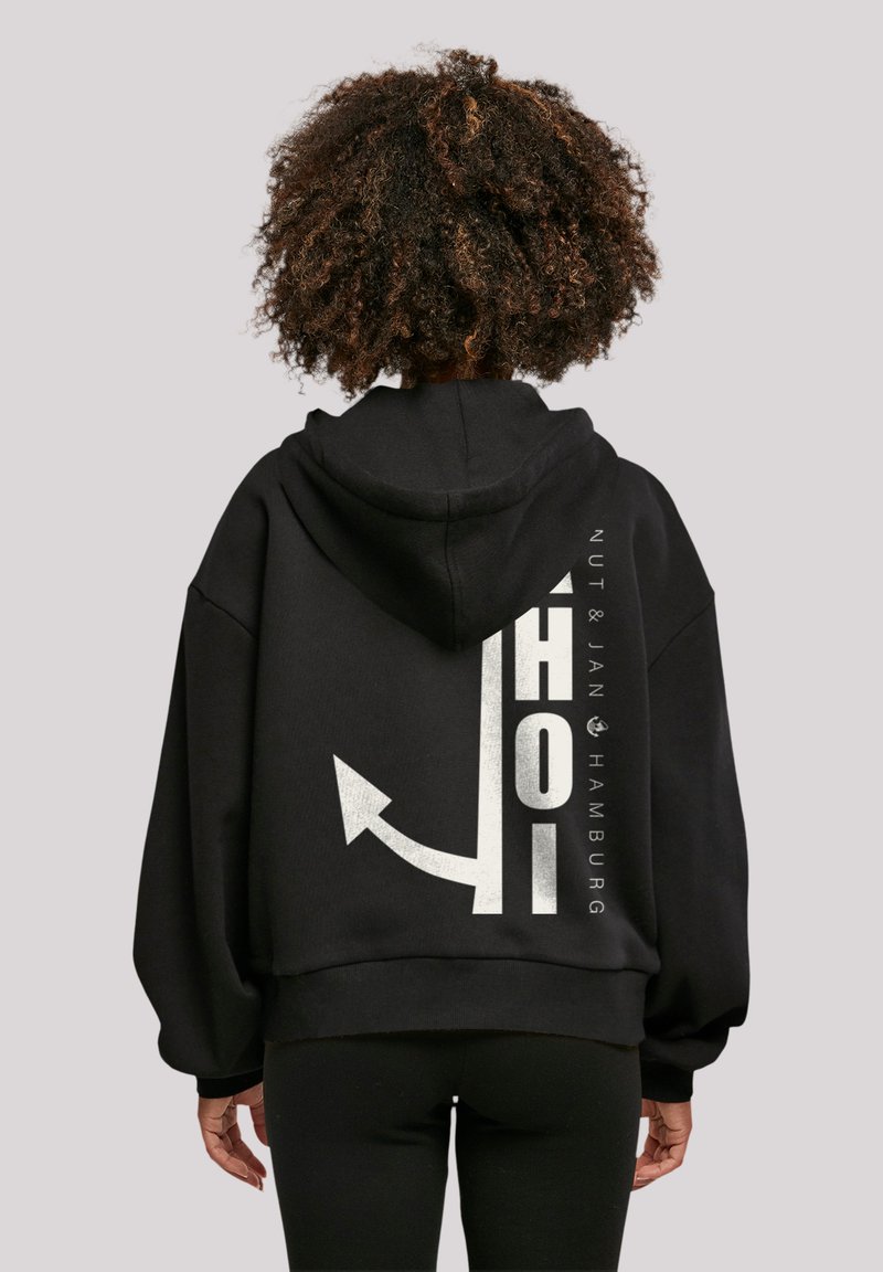 Schwarzes, übergroßes Hoodie mit Kordelzugkapuze, mit einem weißen Grafikdruck und Text auf dem Rücken, aus weichem Stoff gefertigt.