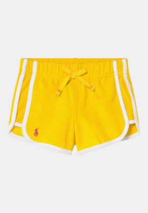 Gule atletikshorts med hvide sideaccenter, elastisk talje og matchende snøre. Har en lille pink logo foran.