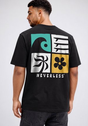 Man wearing black t-shirt with colorful abstract wave, palm tree, flower, and bird graphics and the word "NEVERTHELESS" on the back.