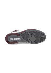 Podošva tenisky Reebok s šedou gumovou podrážkou s rybárskym vzorom, marhuľovými akcentmi a kruhovým vzorom trakcie.