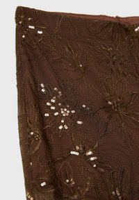 Brown fabric with floral embroidery and gold sequins. Sheer texture with intricate designs and a slightly shimmering surface.