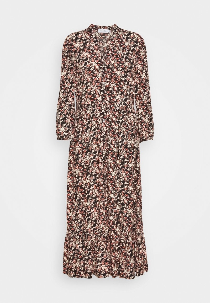 Longue robe noire avec imprimé floral rose et blanc, manches longues, devant boutonné et ourlet froncé.