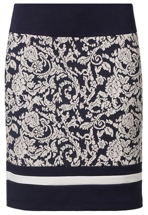 Marineblå nederdel med bred linning, indviklet hvidt blomster- og vinmønster samt en vandret hvid stribe nær forneden.
