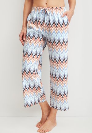 Losse broeken met chevronpatroon in blauw, wit, zwart en beige tinten, voorzien van een elastische tailleband en zijzakken.
