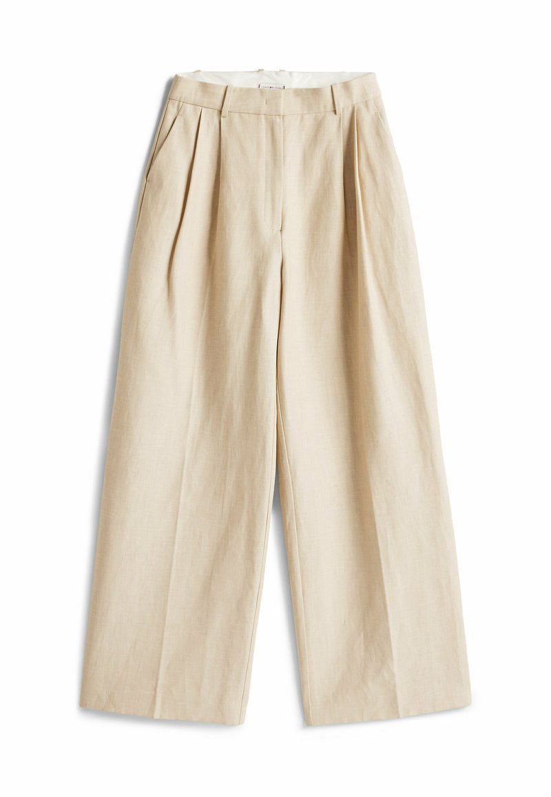 Pantalons larges beige en tissu mélangé de lin. Avec des plis, des poches latérales et une taille avec passants de ceinture. Fini lisse et texturé.