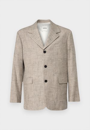 Blazer texturat bej cu rever clasic, patru butoane negre, două buzunare frontale și un căptușel neted. Design minimalist și croială ajustată.