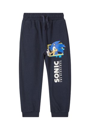 Pantaloni della tuta blu navy in tessuto morbido, con una grafica del cartone animato Sonic the Hedgehog e il testo "SONIC THE HEDGEHOG" sulla gamba.