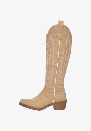 Beige knee-high boots with white decorative stitching, pointed toe, and a low block heel. Features a back pull tab for easy wear.