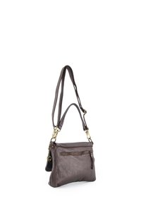 Brown leather handbag with a textured surface, featuring a front zip pocket and adjustable straps, detailed with gold-tone hardware accents.