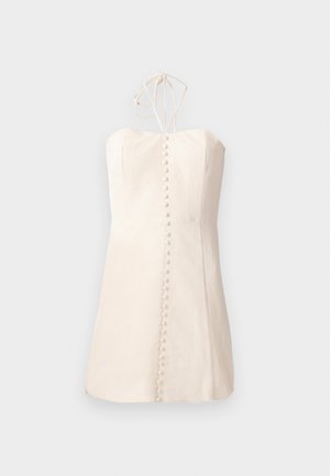 Vestido sin mangas de color blanco roto con un torso ajustado, silueta recta simple y botones decorativos en el frente. Con cintas ajustables en la parte posterior.