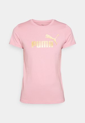 T-shirt rosa chiaro in cotone, con logo "PUMA" stampato in oro e un'immagine di un puma che salta sull'area del petto sinistro. Maniche corte.