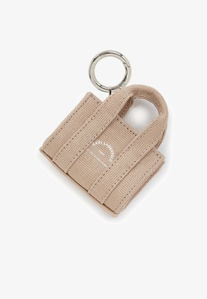 Miniature tan canvas tote bag with stitched detailing, dual handles, and a silver keyring attachment. Displays "Karl Lagerfeld" branding.