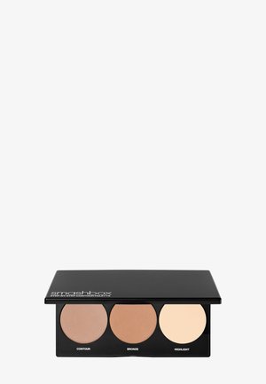 Smashbox contour-palette med tre runde rum: lys beige highlight, medium brun bronze, mørk brun contour, i et sort rektangulært plasthus.