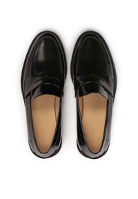 Black leather loafers with a smooth finish, featuring a cushioned insole and a decorative strap across the top. Rounded toe design.