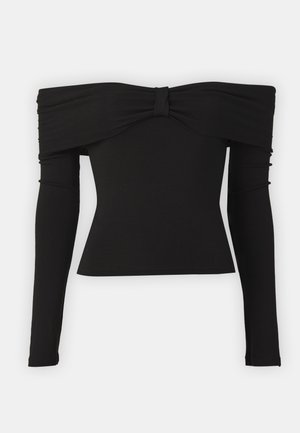 Melnas off-the-shoulder blūzes ar loku akcentu ap kaklu, garām piedurknēm un pieguļošu dizainu no gludas, elastīgas auduma.