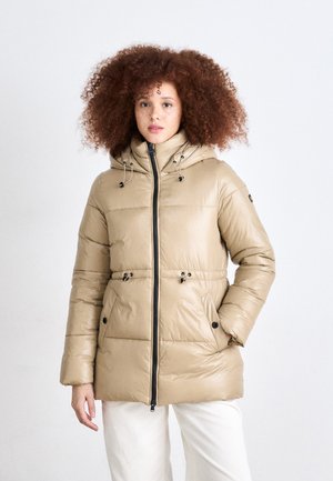 Beige puffer jacket with a zippered front, adjustable hood, and side pockets. Features quilted texture and drawstring waist for fit adjustment.