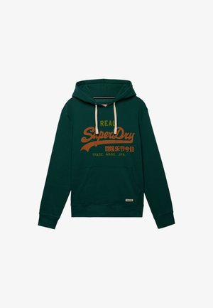 Sudadera con capucha verde oscuro con bolsillo delantero tipo canguro, cordones crema y logo naranja "Real SuperDry" con texto japonés y "Trade. Mark. JPN."