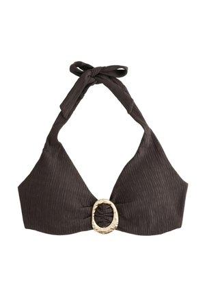 Close-up of a person wearing a textured dark brown bikini top with a large circular gold clasp at the center.