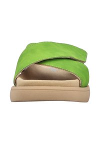 Green suede slide sandal featuring a wide overlapping strap design, beige cushioned insole, and a flat rubber outsole.