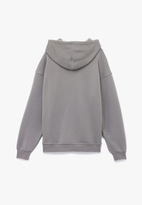Grijze hoodie met een trekkoord in de capuchon, ribgebreide manchetten en zoom, en een zachte textuur. Heeft een relaxte pasvorm en minimalistische stikseldetails.