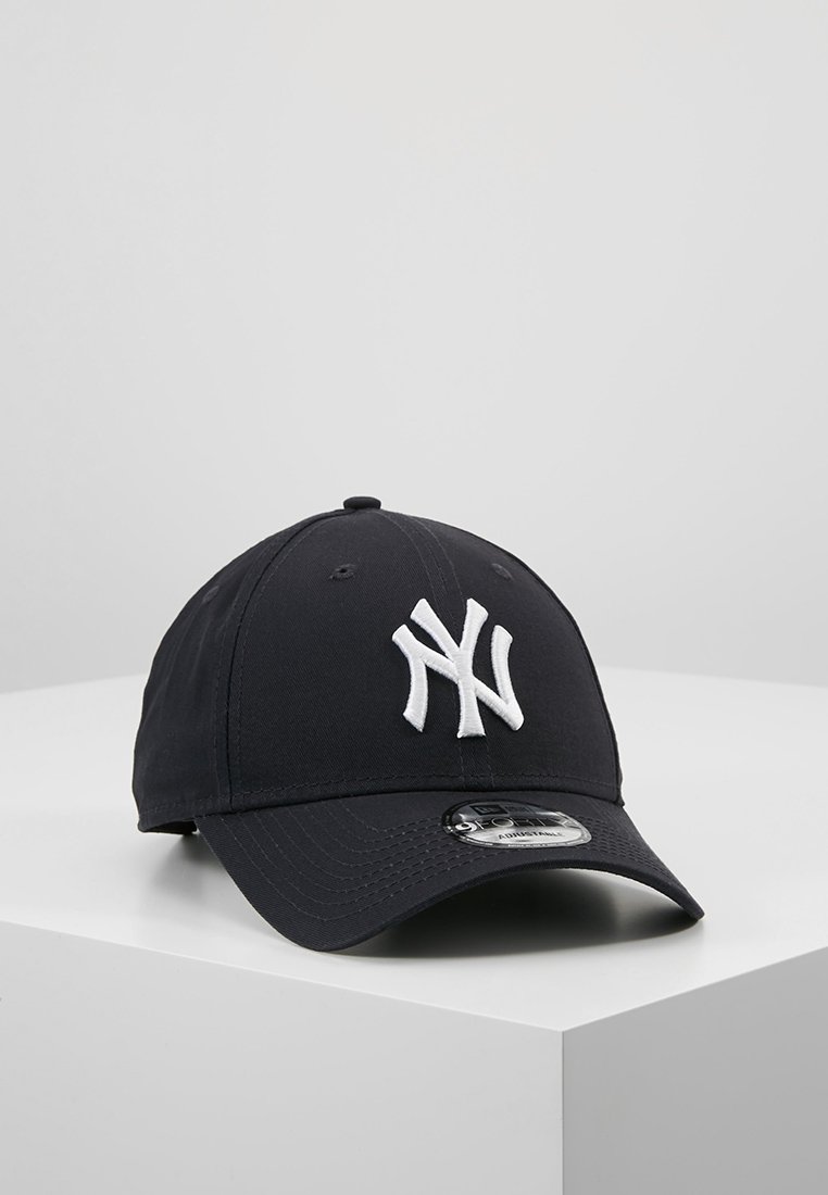 Black baseball cap with a white embroidered "NY" logo on the front, structured design, curved brim, and a shiny, plastic adjuster on the back.