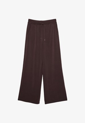 Weite, dunkelbraune Hose mit elastischem Bund, Kordelzug und seitlichen Taschen, auf weißem Hintergrund präsentiert.
