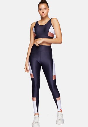 STRAPPED - Medium support sports bra - marine