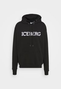 Sweatshirt à capuche noir avec poche ventrale et texte blanc "ICEBERG" sur la poitrine, doté de cordons ajustables sur la capuche.