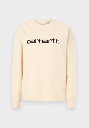 Μπεζ φούτερ Carhartt με στρογγυλή λαιμόκοψη, μακρύ μανίκι και μαύρο λογότυπο "carhartt" στο κέντρο του στήθους.
