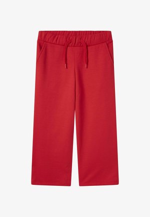 Pantalons de survêtement larges rouges avec taille élastique, cordon de serrage et poches latérales sur fond blanc.
