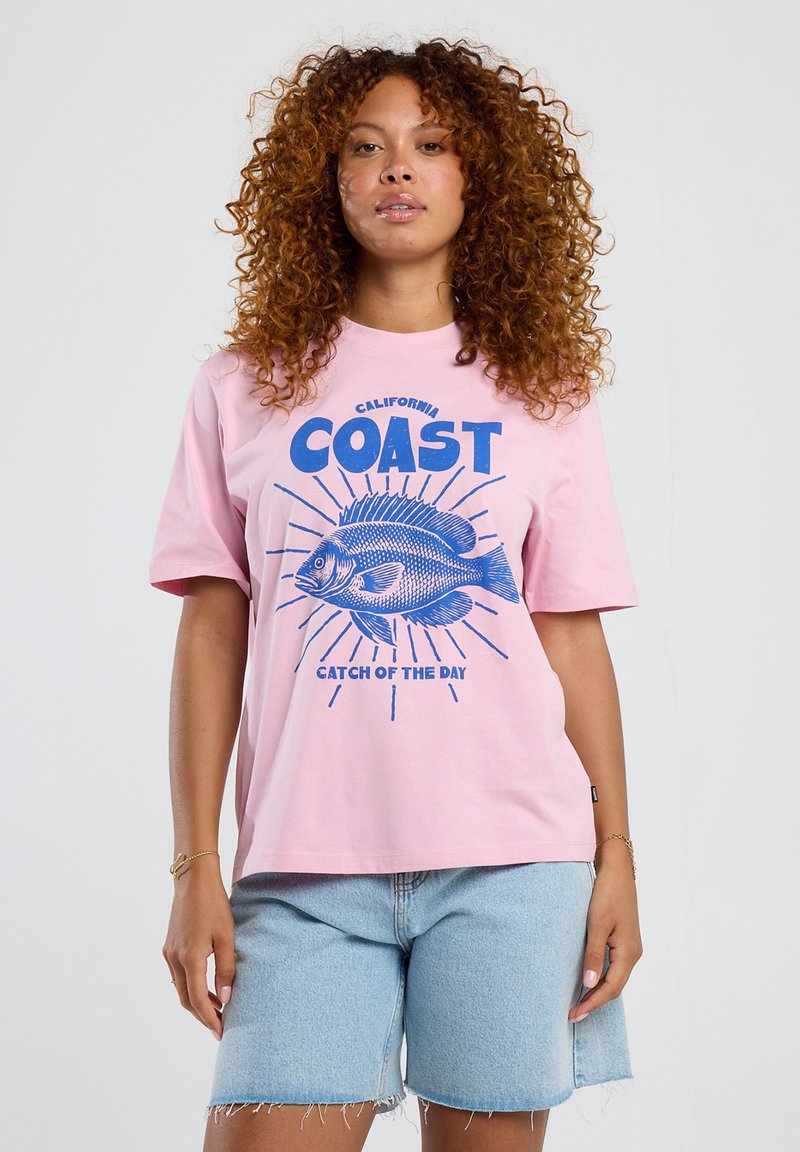 Pink cotton t-shirt with blue graphic of a fish, text "California Coast" and "Catch of the Day," short sleeves, relaxed fit.
