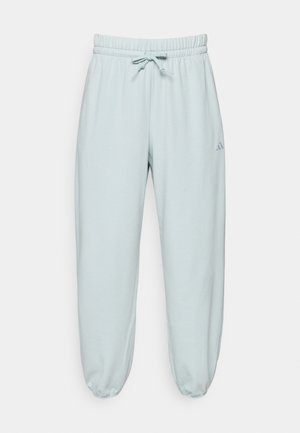 Pantalon de survêtement bleu clair en mélange de coton, doté d'une taille élastique avec cordon de serrage et de chevilles resserrées. Comprend un petit détail de logo.