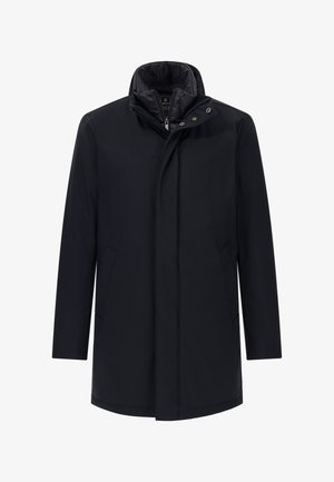 Melnā ūdensizturīgā jaka ar augstu apkakli, ar rāvējslēdzēju, priekšējiem kabatām un gludu auduma tekstūru. Ievērojama minimālistiska dizaina un pielāgotas piegriezuma īpašības.