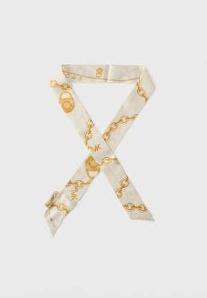 Cream-colored silk scarf with gold chain and padlock patterns folded in an X shape on a white background.