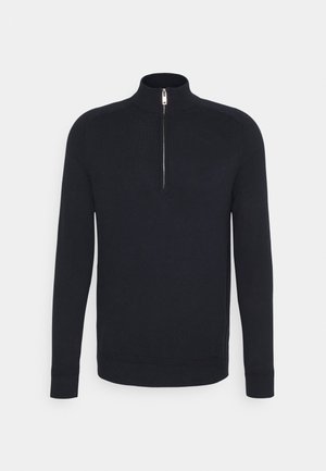 Black long-sleeve sweater with ribbed high collar and front silver half-zip closure, displayed against a light background.