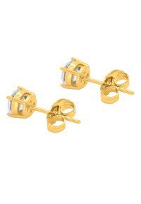Gold stud earrings featuring a round stone in a pronged setting, paired with a curved post and backing for secure wear.
