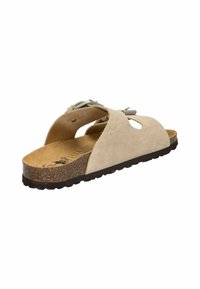 Beige suede sandal featuring cut-out design, cork footbed, brown rubber sole, and adjustable strap with metallic hardware.