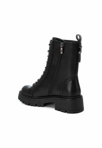 XTI Botines con plataforma - black