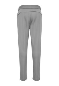 Szare, zwężane spodnie sportowe z elastycznym pasem, z subtelnym logo marki, pokazane od tyłu na białym tle.