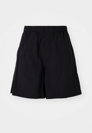 Black shorts made of textured fabric with a ribbed pattern. Features an elastic waistband and relaxed fit. Ends just above the knee.