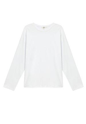Camiseta de manga larga de algodón blanca con cuello redondo, corte relajado y hombros caídos para una comodidad óptima.