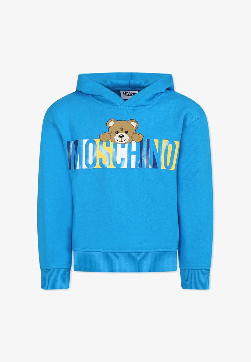 Sweat à capuche bleu avec un graphique d'ours et logo "Moschino" en lettres grasses jaunes et blanches. Présente une capuche avec cordon de serrage et des poignets côtelés.