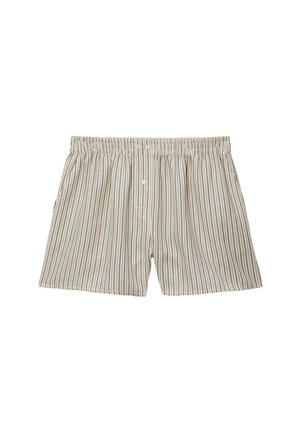 Boxer en coton beige et blanc à rayures verticales avec ceinture élastique et trois boutons blancs sur la braguette devant.