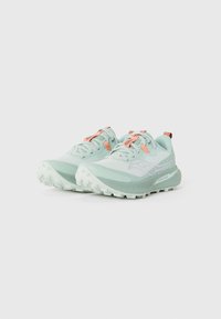 Light mint green athletic shoes with mesh upper, contrasting pink accents, thick white sole with traction lugs for grip.
