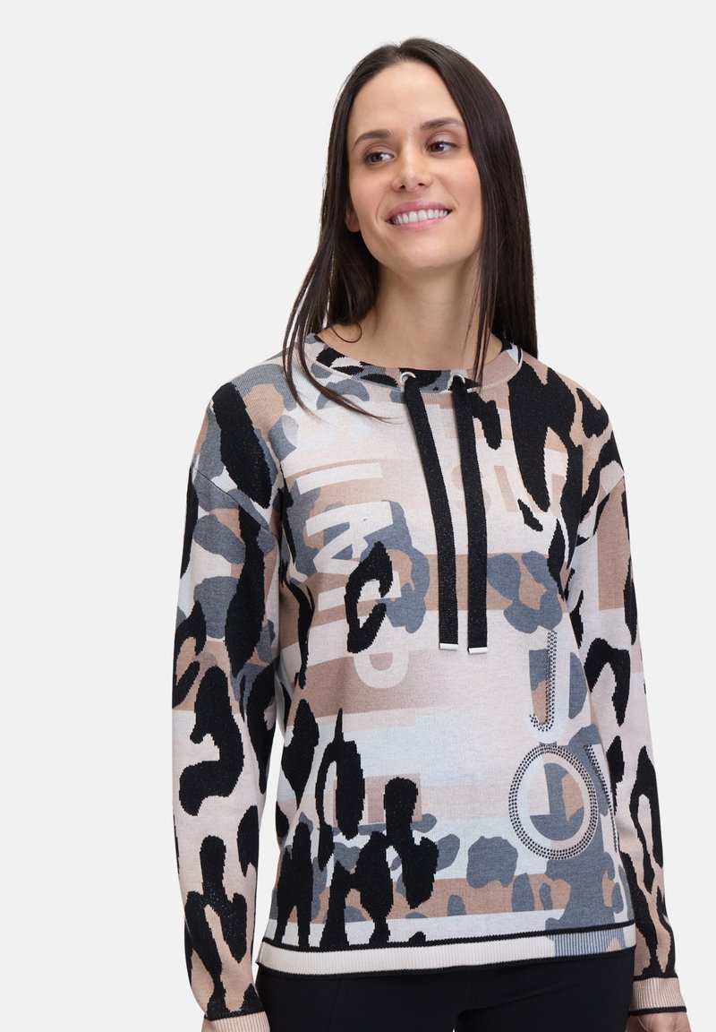 Knit sweater featuring a multicolor leopard print design with light beige, black, and blue accents. Drawstring hood and ribbed cuffs.