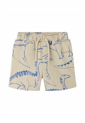 Beige børneshorts med elastik i taljen, snørebånd og blå omrids dinosaur print, herunder stegosaurus og pterodaktyl på stoffet.
