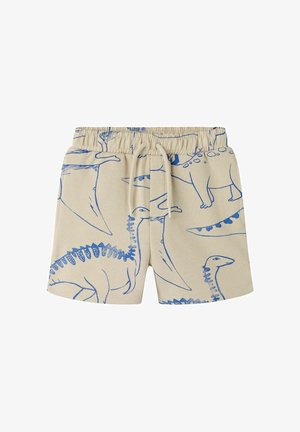 Beige børneshorts med elastik i taljen, snørebånd og blå omrids dinosaur print, herunder stegosaurus og pterodaktyl på stoffet.