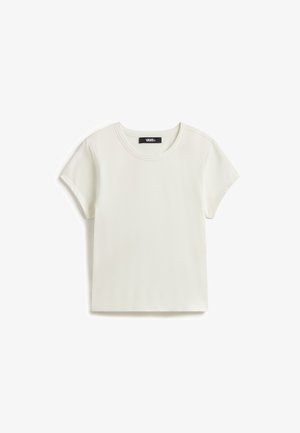 T-shirt uni blanc à manches courtes Vans avec col rond et petite étiquette noire Vans à l'intérieur du col.