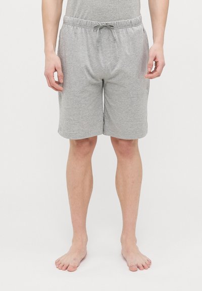 Shorts en coton gris avec une taille élastique, un cordon de serrage et des poches latérales, atteignant juste au-dessus du genou.