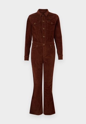 Jupe en velours côtelé marron avec col, manches longues, jambes évasées, poches poitrine et accents de boutons en métal. Texture lisse et design ajusté.